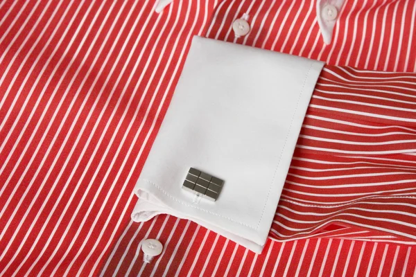 Cuff link on men's red shirt — Stock Photo, Image