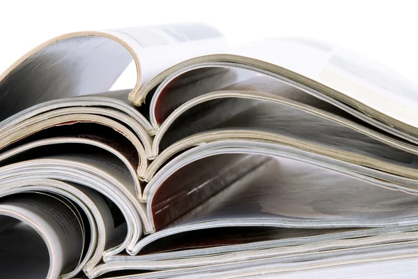 Pile of magazines with bending pages — Stock Photo, Image