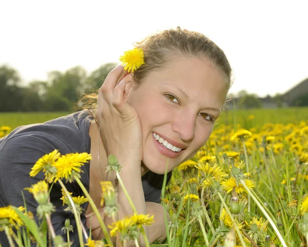 Woman on a flower meadow — Stock Photo, Image