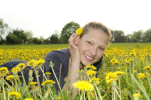 Woman on a flower meadow — Stock Photo, Image