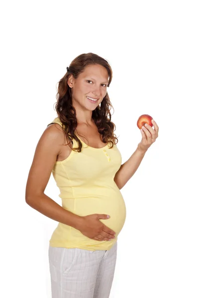 Zwangere vrouw met appel — Stockfoto