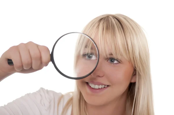 Young woman with magnifying glass — Stock Photo, Image