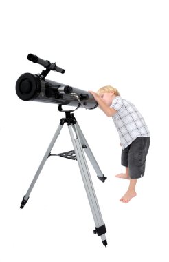 Young child or boy looking through a telescope clipart