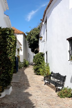 Narrow, cobbled streets of Spanish Pueblo clipart