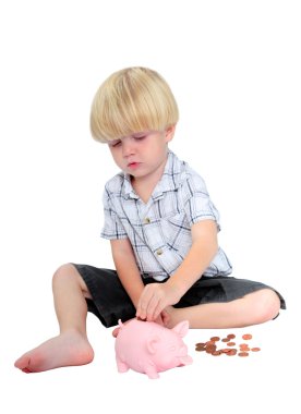 Young boy putting money into a piggy bank clipart