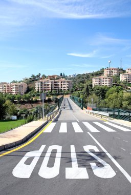 New road and bridge over golf course in Spain clipart