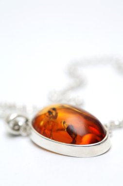 Silver necklace with Amber inlay clipart