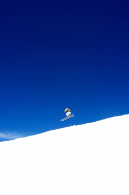 Man skiing on slopes of Prodollano ski resort in Spain clipart