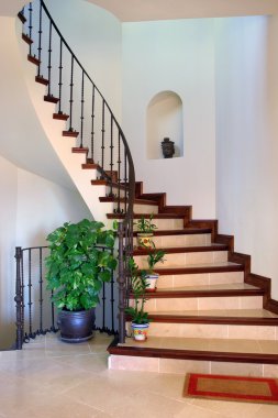 Rustic interior hallway and stairs of large Spanish Villa clipart