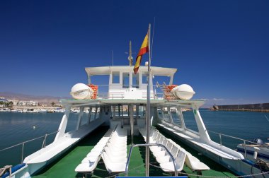 Rear of tour boat at Roquetas del Mar port in Spain clipart