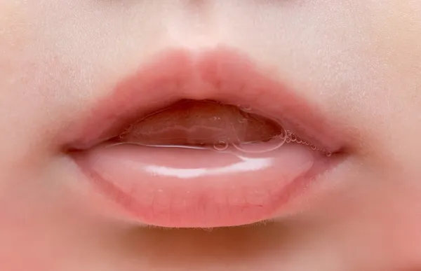 Close up of lips of baby girl — Stock Photo, Image