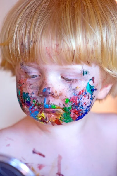 Young toddler covered in face paint — Stock Photo, Image