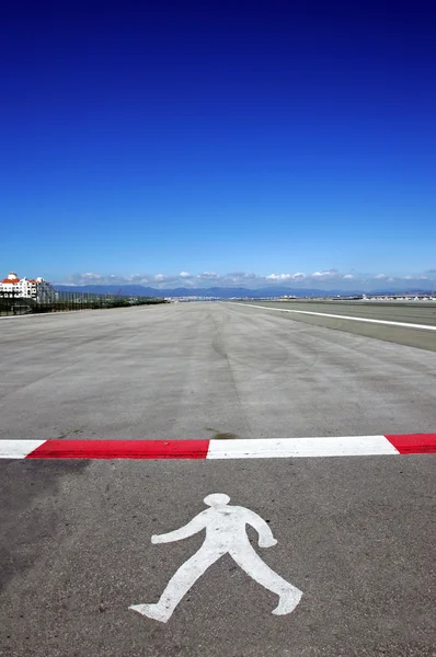 stock image Symbol of walking man on runway at Gibraltar airport