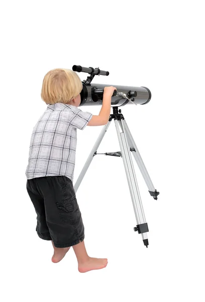 Niño pequeño o niño mirando a través de un telescopio — Foto de Stock