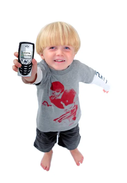 Jovem menino segurando telefone celular mostrando santa chamada — Fotografia de Stock