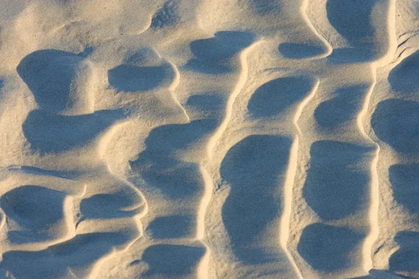 Rimpelingen in het zand achtergelaten door golven op een strand in Engeland — Stockfoto