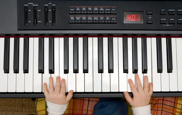 stock image Young boys hands on an electronic piano or keyboard