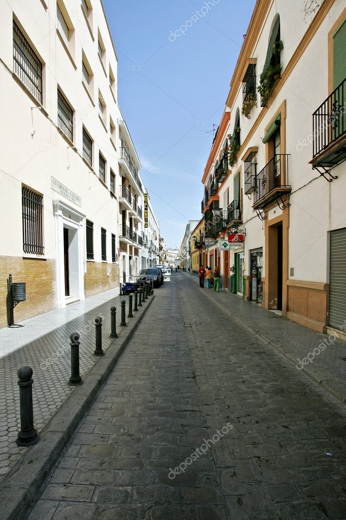 Old deserted street of houses and apartment in Seville Andalucia