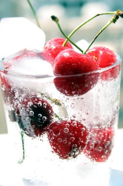Cherries fruit in glass with ice clipart