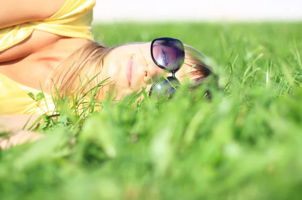 stock image The girl on the green grass.