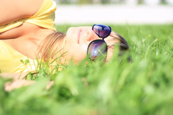 stock image The girl on the green grass.