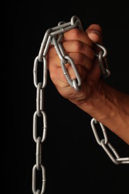 Hand and a chain. clipart