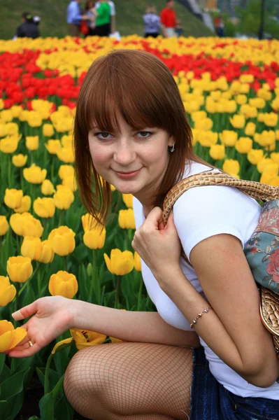 Girl and flowers. — Stock Photo, Image