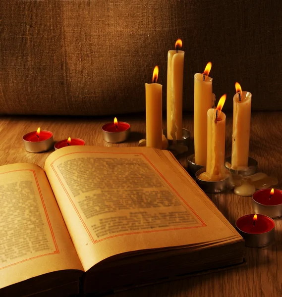 Open Old Book and Burning Candles — Stock Photo, Image