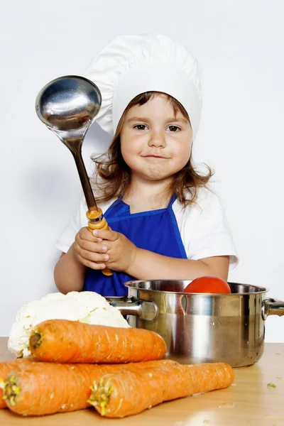 Smiling Girl in Cook's Cap Preparing Food — Stock Photo, Image