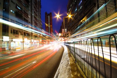 Traffic in downtown at night clipart