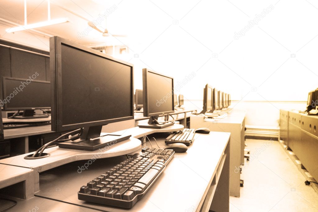 Workplace room with computers in row