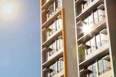 New apartments building and blue sky as a background clipart