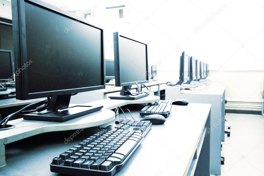 Workplace room with computers in row