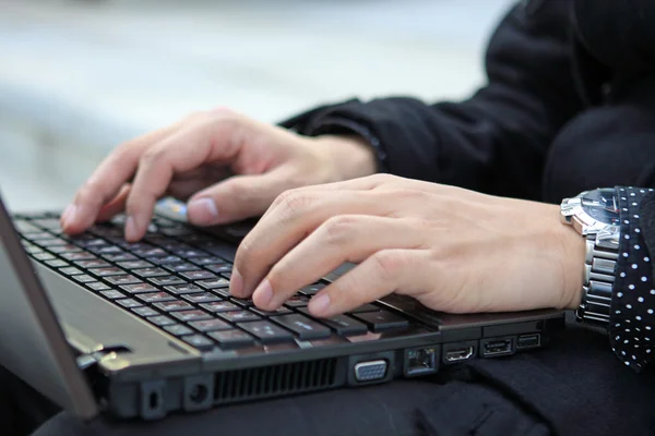 Hands typing on laptop computer keyboard close up — Stock Photo, Image