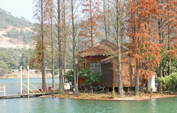Wood house on water — Stock Photo, Image
