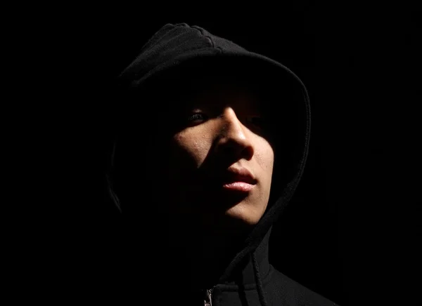 Monochrome picture of a guy in a hood — Stock Photo, Image
