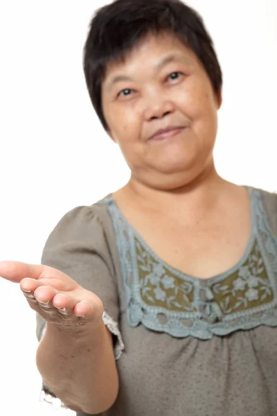 Junge asiatische Frau Hand zeigt leeres Zeichen — Stockfoto