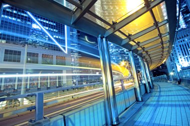 Traffic night and footbridge in hongkong clipart