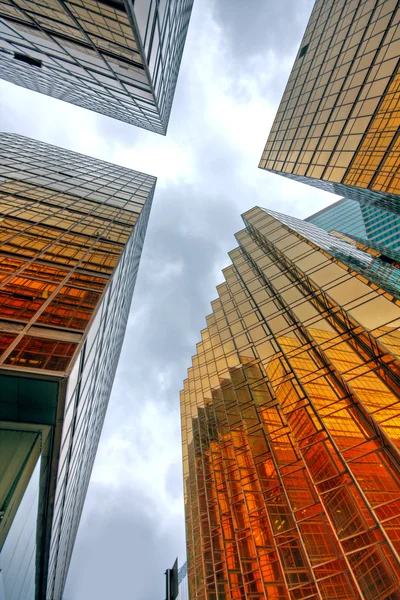 Skyscrapers with clouds reflection — Stock Photo, Image