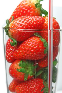 Stawberry in glass on white clipart