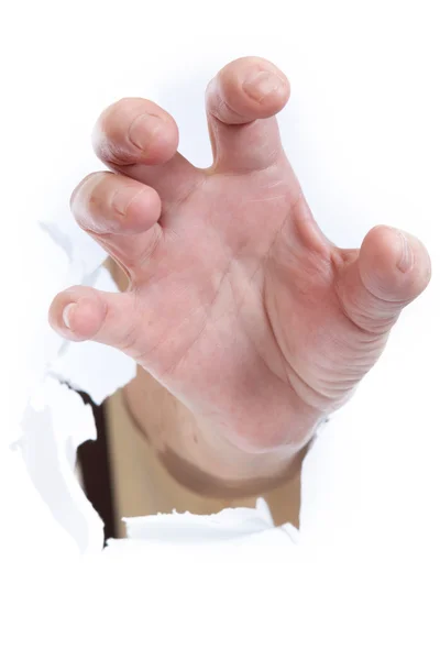 Hand through paper — Stock Photo, Image
