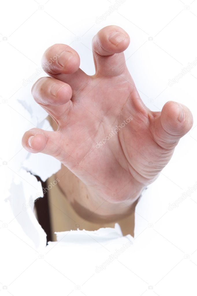 Hand through paper