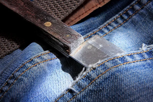 Knife in jeans pocket — Stock Photo, Image