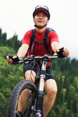 Asian mountain biker clipart