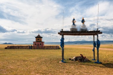 Buddhist temple near the road in Mongolia clipart