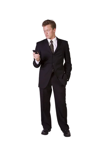 Casual man texting op mobiele telefoon Stockafbeelding