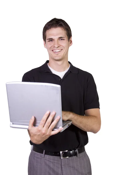 Giovane uomo in piedi e al lavoro sul computer portatile — Foto Stock