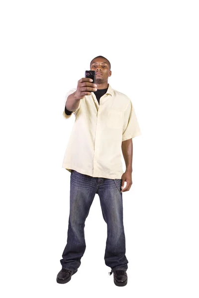Обычный чёрный мужчина фотографирует на телефон. — стоковое фото