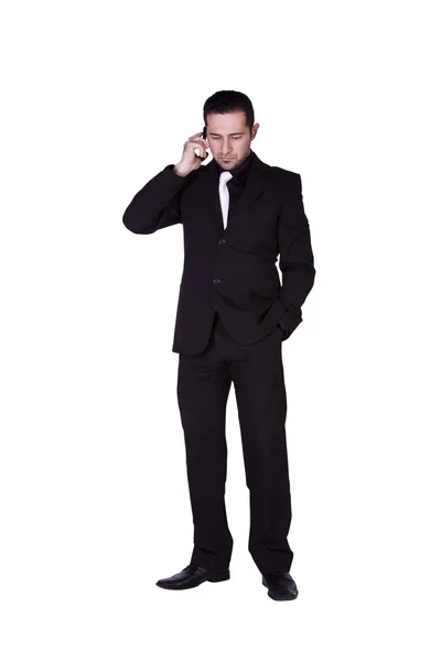 Uomo d'affari che guarda giù mentre parla al telefono — Foto Stock