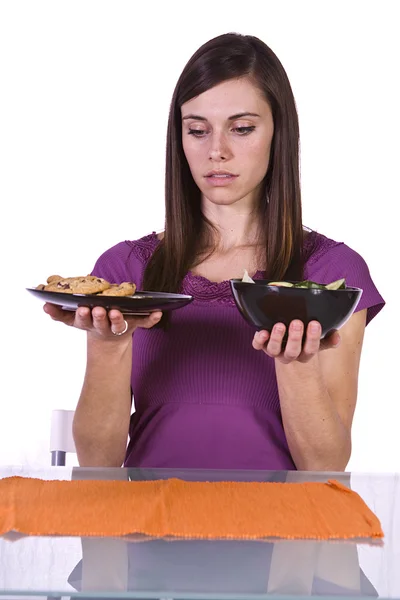 Beautiful Girl Deciding What to Eat Royalty Free Stock Photos